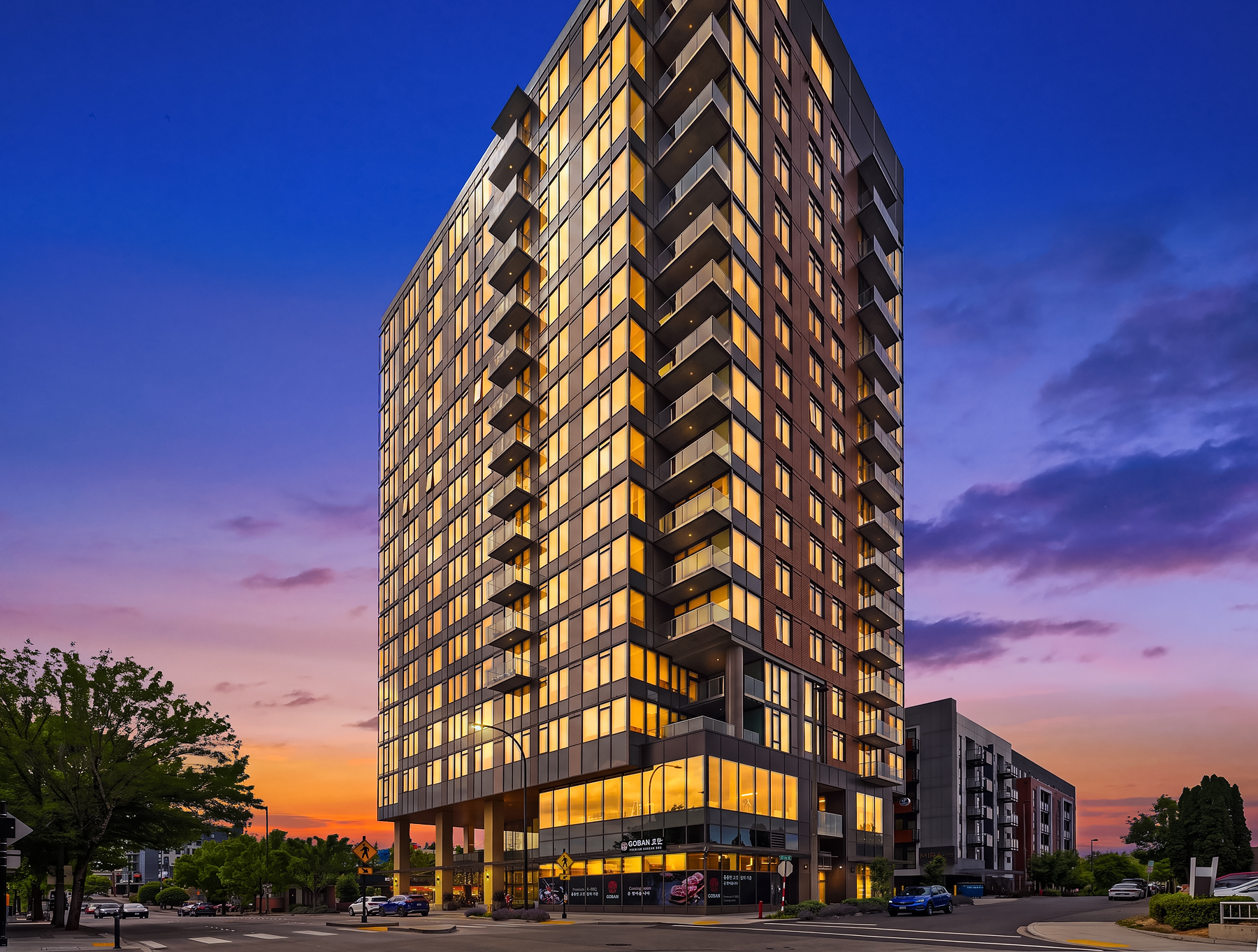 MARI Bellevue at twilight — 20-story boutique high-rise at NE 10th St and 103rd Ave NE