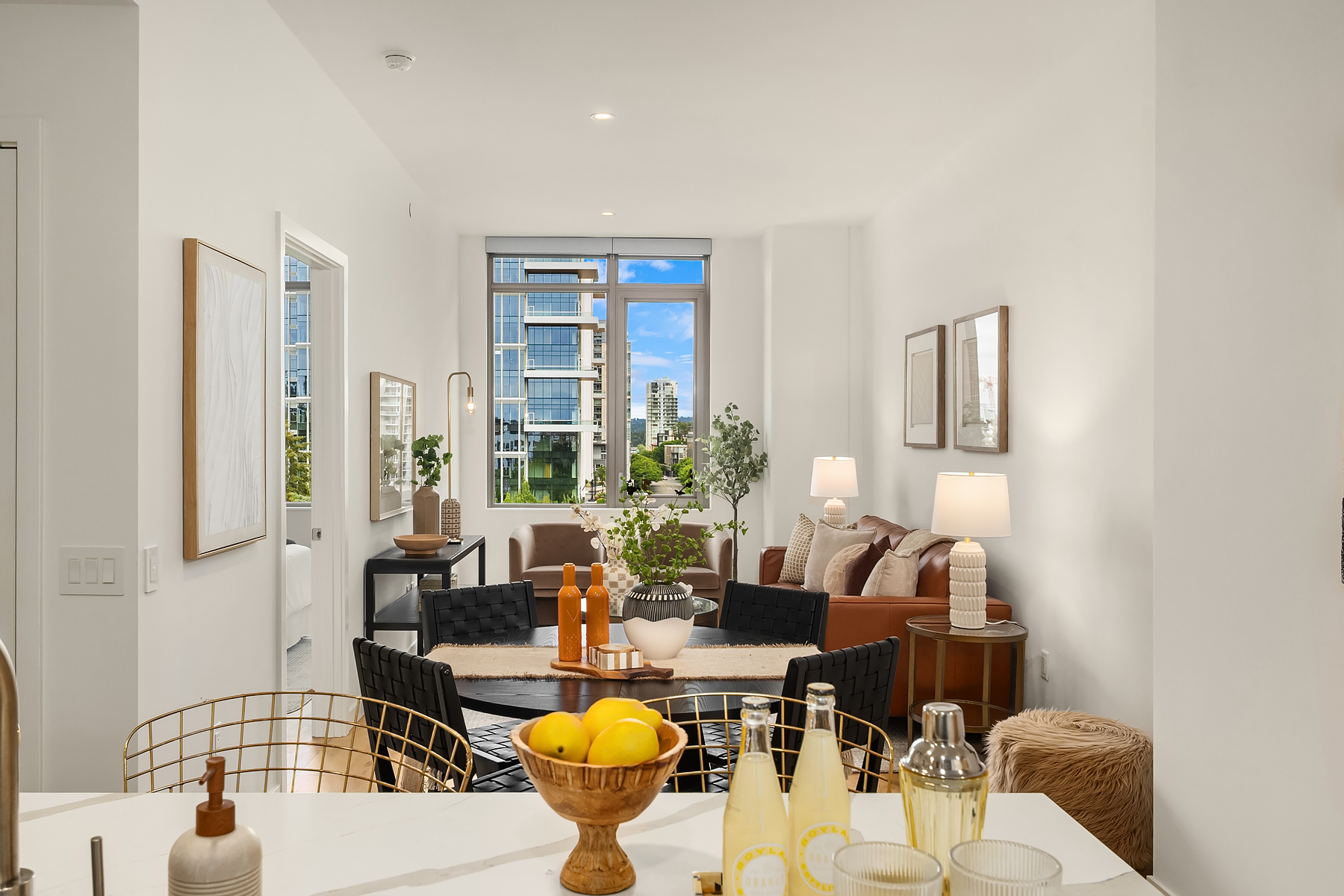 Open living and dining area in Residence 708 with city views