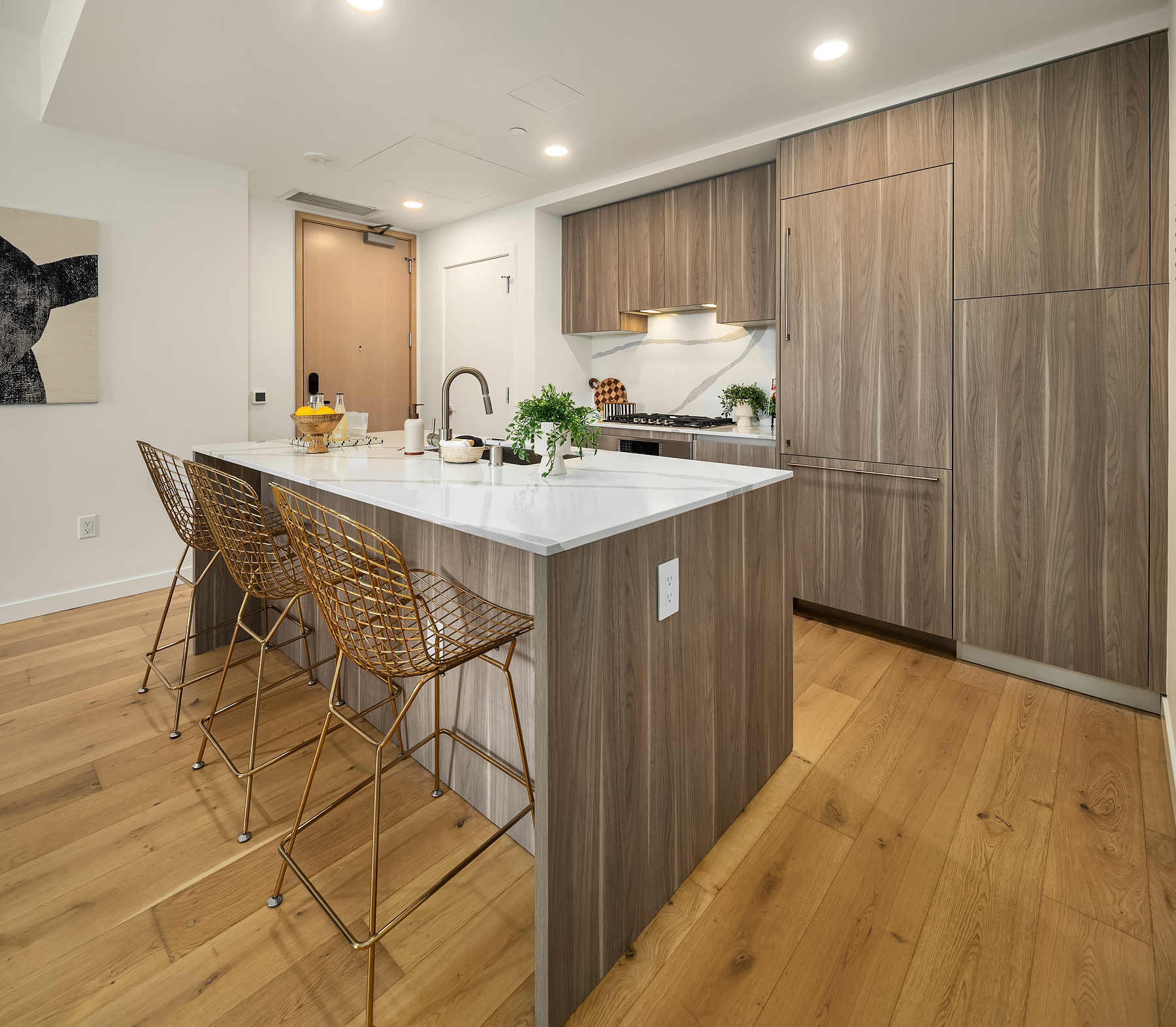 Wood-paneled cabinetry and wide-plank flooring