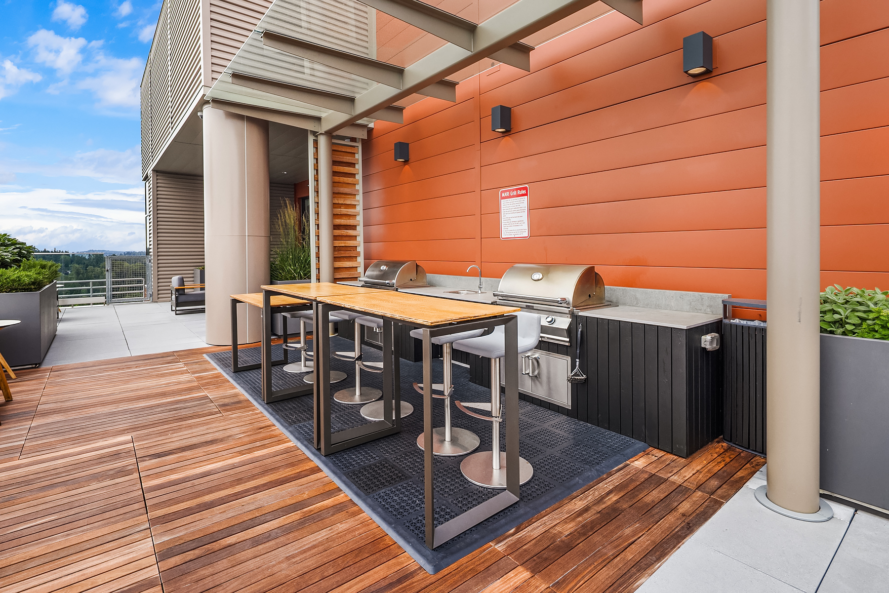 Outdoor BBQ and bar seating on the terrace