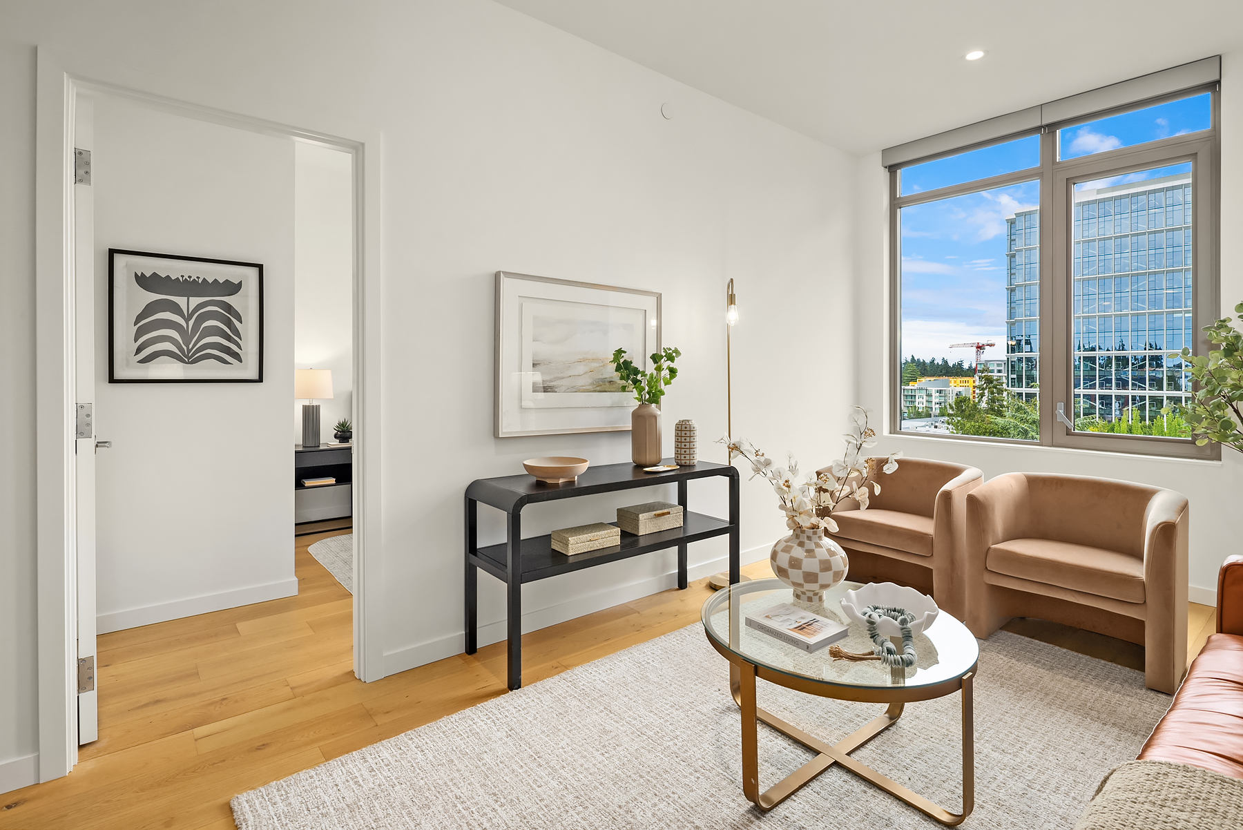Living room with designer furnishings and city outlook