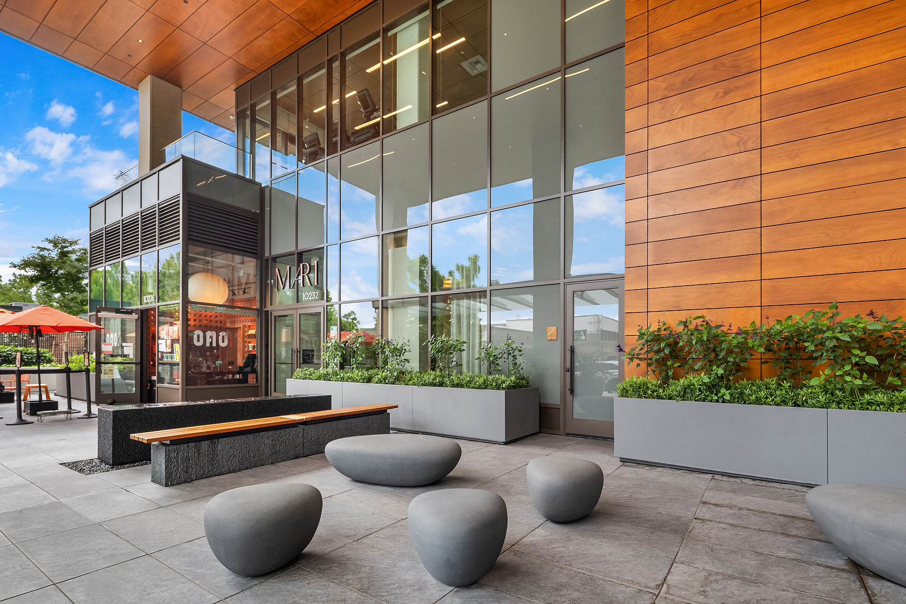 Street-level plaza with landscaped seating